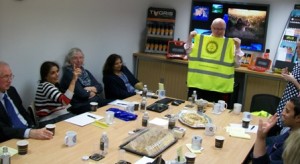 Adrian McGreey shows one version of the personalised high-vis Rotary jackets to his guests