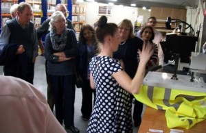 Charlotte shows visitors the dye-sublimation printing process