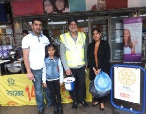 Past-President-Channi-Riyait-with-a-family-who-have-just-donated-to-Rotarys-End-Polio-Now-Campaign