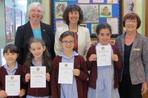 Rotarians Pam Spokes and Diana Thurston flank headteacher Mrs Patricia Mason behind the winning Young Writer pupils from St Thomas More Academy