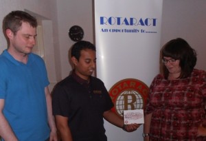 Luc Malherbe, Rotarian Jason Chauhan and president Gemma Kiddy focus on the Rotaract In Business campaign