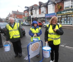 Bert and Diana Thurston brave the elements with Carolyn Robson during the Christmas collection in Queens Road