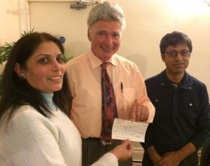 Maya Vansia presents cheque to Roger Neuberg with Deepak Karia