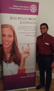 President Nominee Jason Chauhan with a Rotary End Polio Now poster featuring double Olympic champion rower Helen Glover