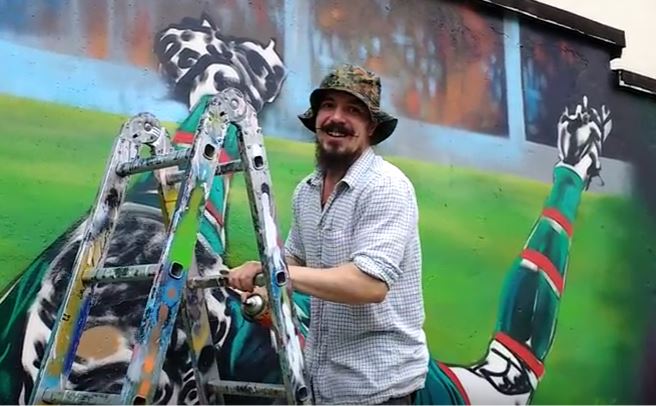 Muralist Leigh Drummond is pleased by the comments he has heard