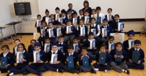 Headteacher Jasbir Mann and Rotary Club Vice President Deepak Karia with children holding the donated tablet PCs. Click on the photo to hear their thanks