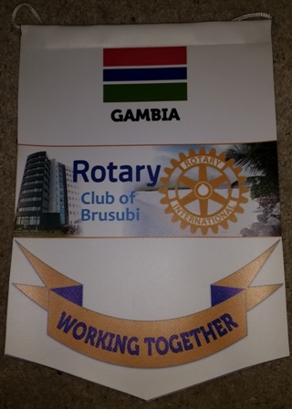 A banner from the new Rotary Club of Brusubi