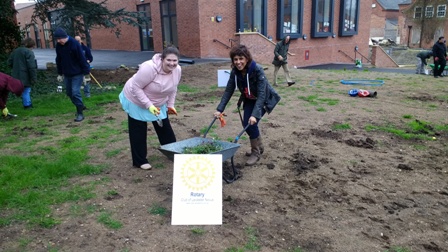 President Gemma Kiddy and Jasbir Mann, headteacher at Falcons Primary School, having fun while working on the Peace Garden