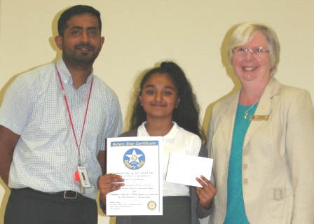 Overall winner Tanicha Vishnukumar with teacher Asif Esat and Rtn Pam Spokes