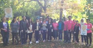 De Montfort University students take a break from planting crocus bulbs to pose for a photo