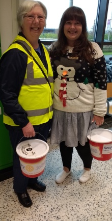 Novus secretary Pam with Immediate Past President Gemma (in the Christmas jumper) collecting