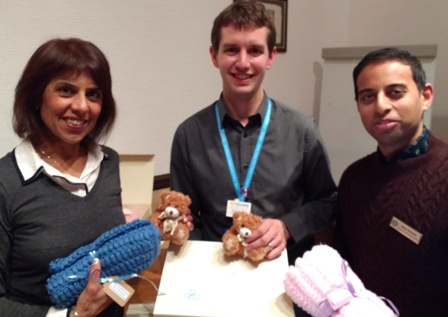 Jasbir Mann and President-Elect Jason Chauhan with Gary Farnfield. of Rainbows Children's Hospice and the memory boxes given to parents