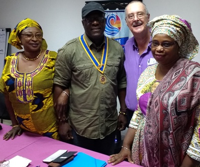 Jim 'Lamin' Matthews with Banki Njie, president of the Rotary Club of Bijilo, with Rotarians Mai (left) and Fatou Bah