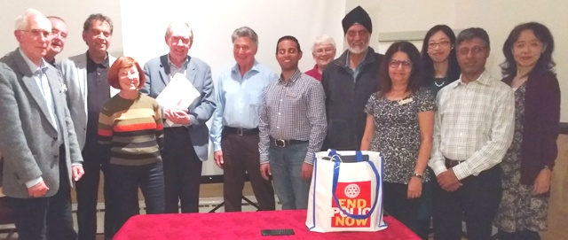 Guest speaker Roger Neuberg with President Jason Chauhan surrounded by Novus members and guests including Mai Tsumura and her mother Yuka on the right