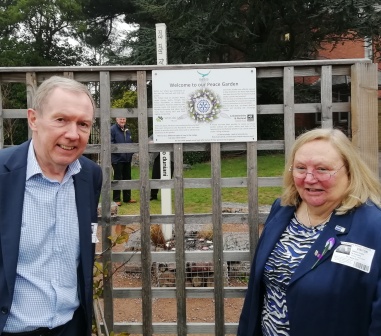 Project leader Frazer Robson with RIBI president Debbie Hodge in front of the trellis for climbing plants