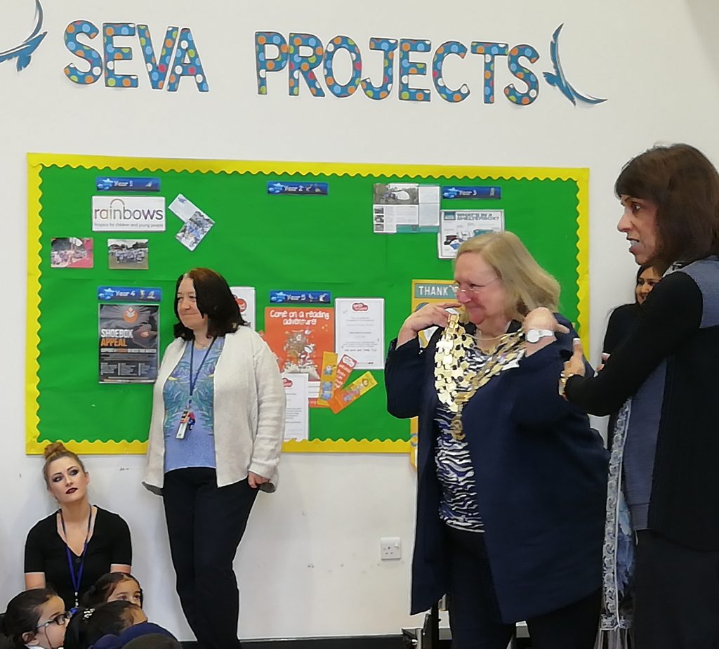 RIBI President Debbie Hodge shows the school assembly her impressive - and heavy - chain of office. Sewa is the Punjabi word for service; a cornerstone of Sikhism and, therefore, of the school