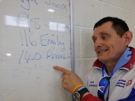 Paul Checkland points to the list of high-scorers, which he topped with a three-dart total of 140