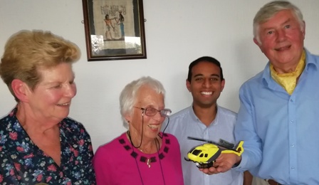 Visitors Sue Lamont and Rachel Kellett, members of Leicester Inner Wheel admire with Presidnet Jason Chauhan the model helciopter held by speaker John Nowell