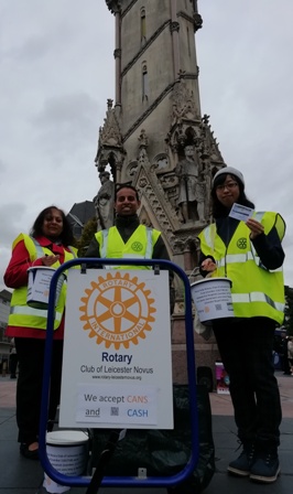 Collectors Sarita Shah, Jason Chauhan and Mai Tsumura pose in front of the Clock Tower