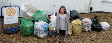 Isabela with 22 bags containing thousands of cans