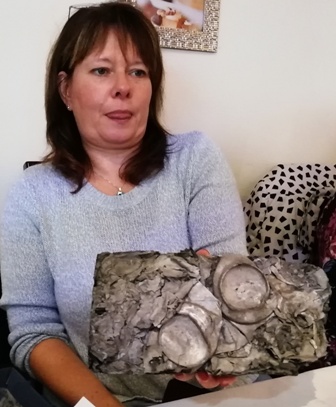 Rotary Club of Sleaford Kesteven President Karen Stearn holds an ingot made of 300 aluminium cans